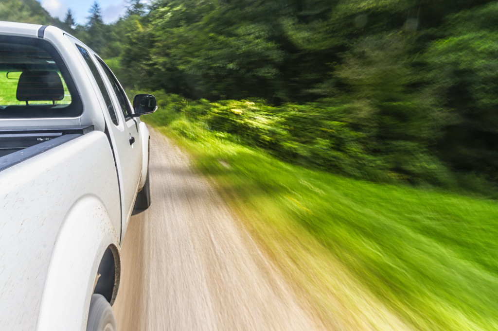 car speeding through a country road