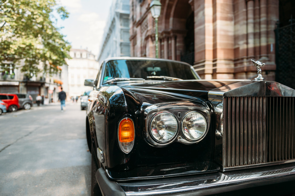 luxury black car driving in the streets